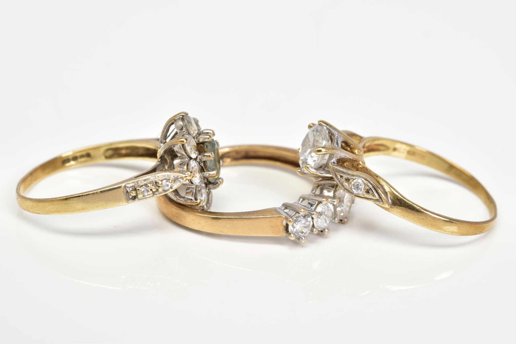 THREE 9CT GOLD GEM SET RINGS, the first designed as a cluster set with a central oval cut aquamarine - Image 2 of 3