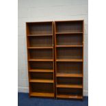 A PAIR OF MID 20TH CENTURY TEAK OPEN BOOKCASES, width 63cm x depth 28cm x height 183cm