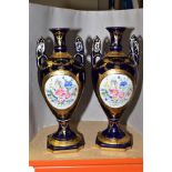 A PAIR OF REPRODUCTION 19TH CENTURY STYLE TWIN HANDLED BALUSTER VASES, blue and gilt ground, painted