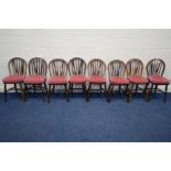 A HARLEQUIN SET OF EIGHT EARLY 20TH CENTURY OAK SPINDLE HOOP BACK CHAIRS, some chairs stamped A