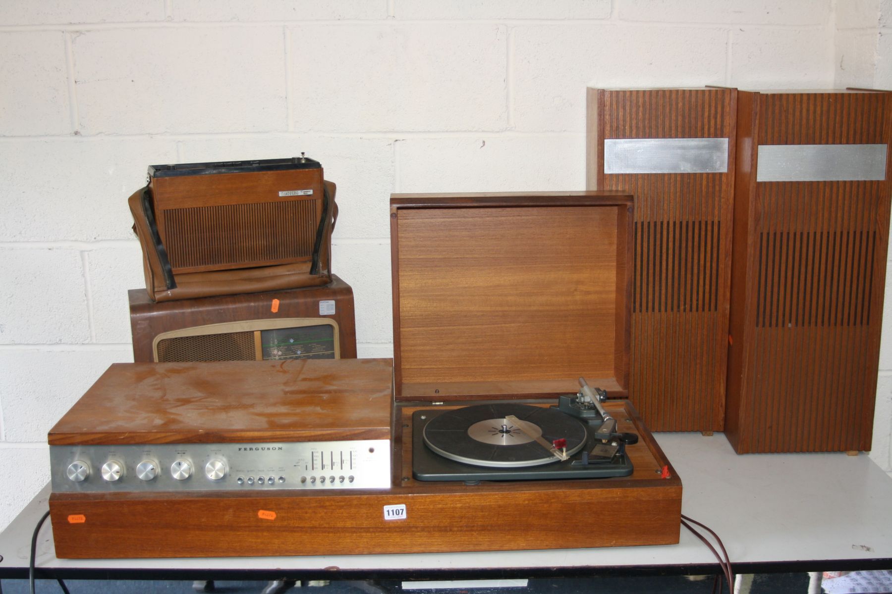 A VINTAGE FERGUSON MODEL 3400 RADIO GRAM, standing on a teak stand, fitted with a Garrard SP12 Mk2