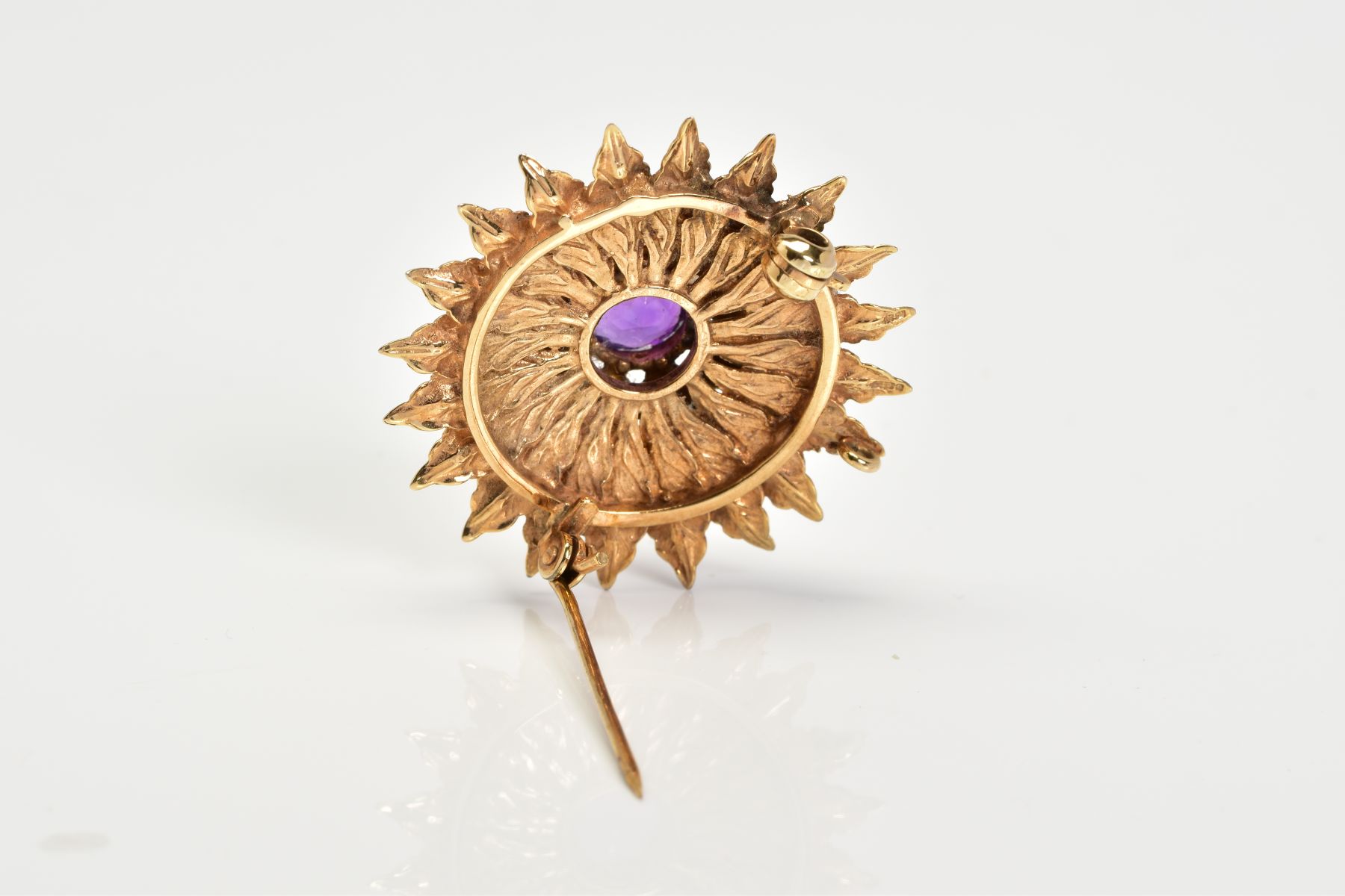 A 9CT GOLD AMETHYST AND PEARL BROOCH, of floral design set with a central circular cut amethyst - Image 3 of 3