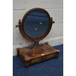 A GEORGE IV MAHOGANY CIRCULAR TOILET MIRROR, supported on a U shaped frame, rectangular base with