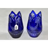 A PAIR OF CONTINENTAL OVERLAID GLASS VASES, possibly Bohemian, fruit and swag engraved decoration,