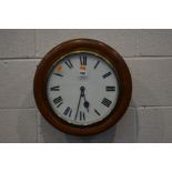 AN EARLY 20TH CENTURY CIRCULAR WALL CLOCK with Fusee movement, key and pendulum 42cm external