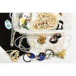 A SELECTION OF COSTUME JEWELLERY, to include beaded necklaces, yellow metal costume earrings, rings,