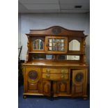 AN EARLY 20TH CENTURY ARTS AND CRAFTS POLLARD OAK AND OAK MIRROR BACK SIDEBOARD, with an overhanging
