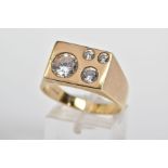 A 9CT GOLD CUBIC ZIRCONIA SIGNET RING, designed with four graduated circular cut cubic zirconia
