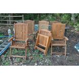 A SET OF SIX HARDWOOD FOLDING GARDEN CHAIRS, badge stating Firman Leisure Furniture to rear of