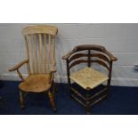 A GEORGIAN CORNER CHAIR with later rush seat and a Victorian elm seated Windsor arm chair