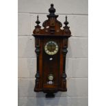 A LATE 19TH CENTURY WALNUT AND EBONISED SMALL VIENNA WALL CLOCK, height 97cm (winding key and