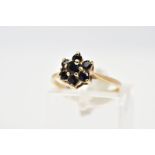 A 9CT GOLD SAPPHIRE CLUSTER RING, the tiered cluster set with circular cut sapphires, to the tapered