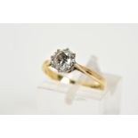 A SINGLE STONE DIAMOND RING, the yellow metal ring set with a single round brilliant cut diamond,