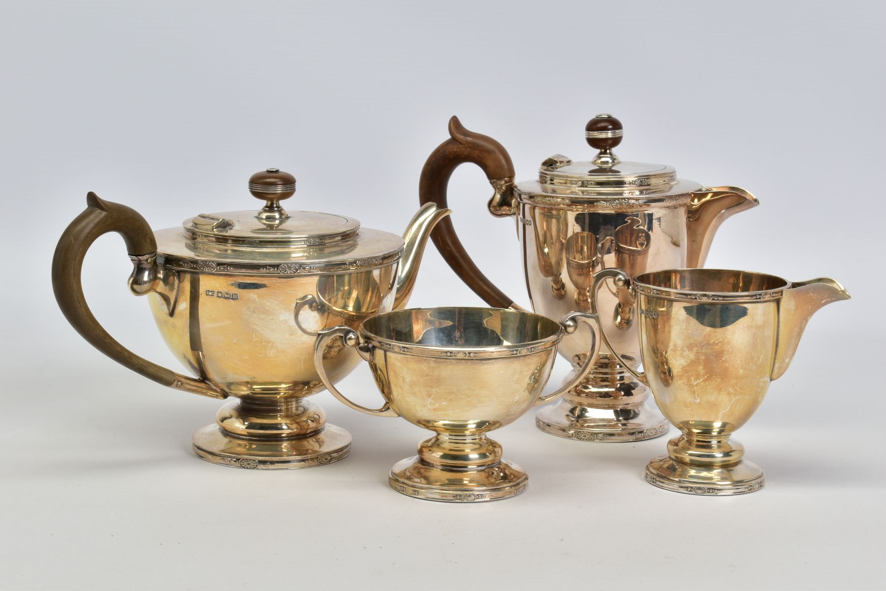 A MATCHED GEORGE V AND ELIZABETH II SILVER FOUR PIECE TEA SERVICE OF CIRCULAR FORM, cast rims with - Image 3 of 6