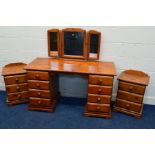 A MODERN PINE DRESSING TABLE with eight drawers, width 133cm x depth 56cm x height 75cm, a triple