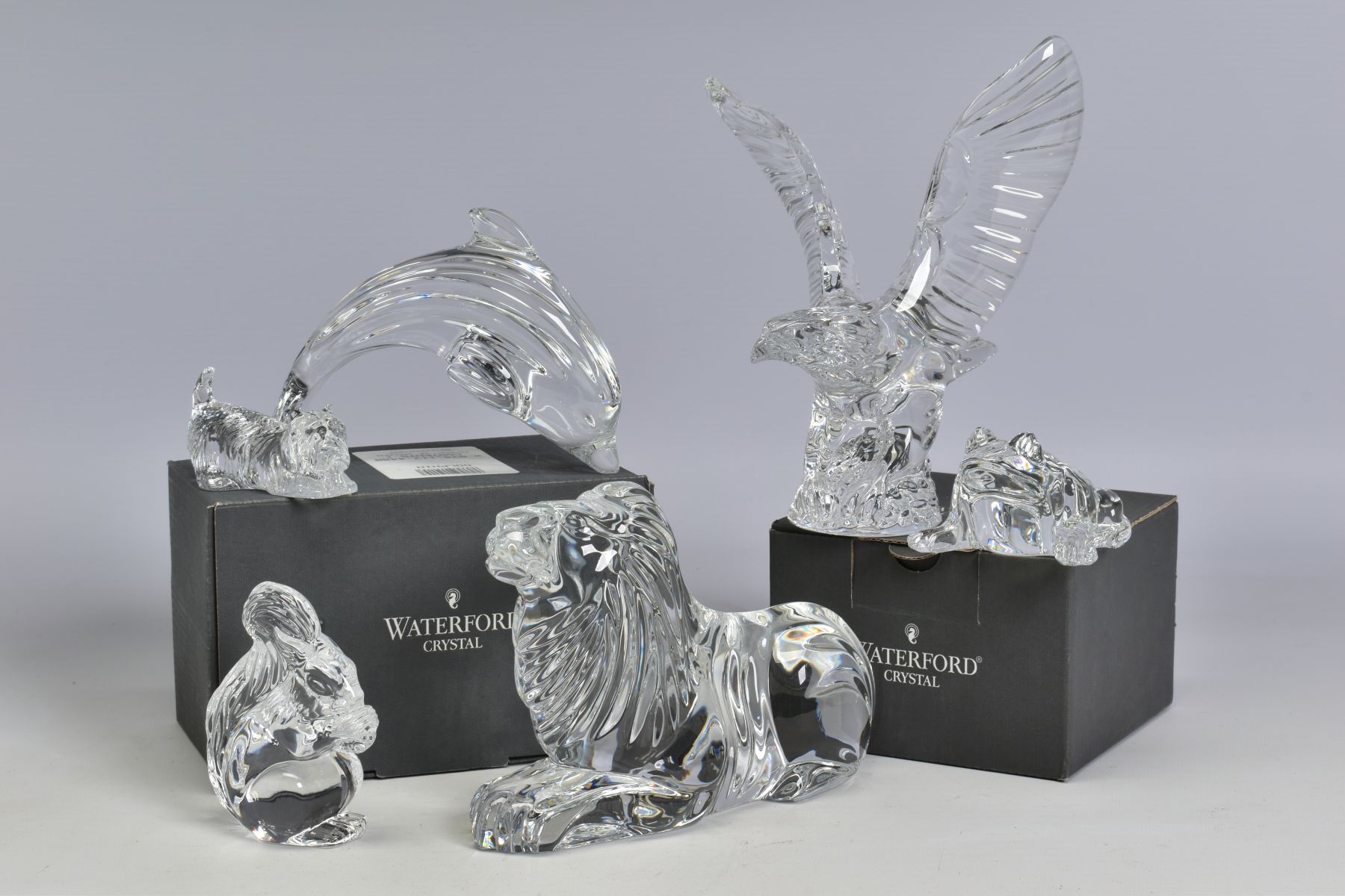 A GROUP OF WATERFORD CRYSTAL ANIMAL FIGURES, comprising recumbant lion, length 17.5cm, boxed