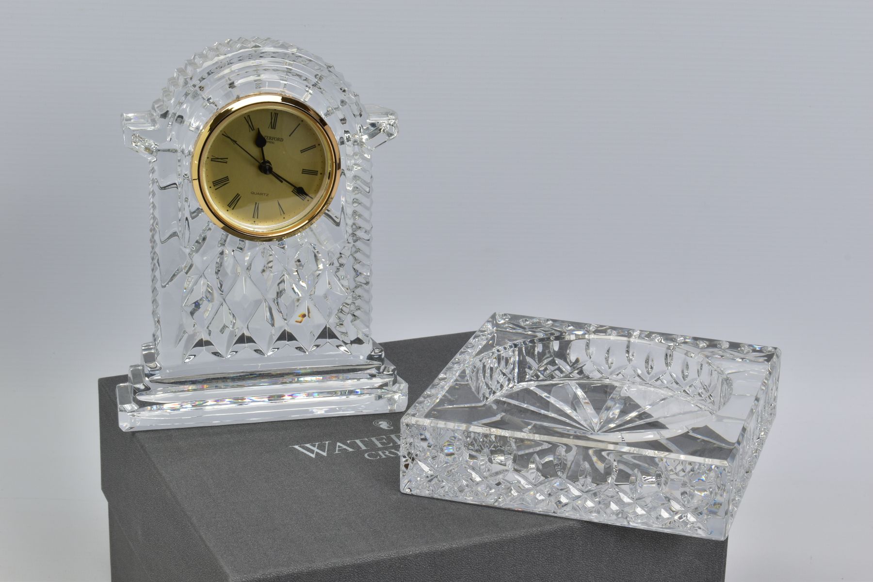 A BOXED WATERFORD CRYSTAL 'GOLD FACED CARRIAGE CLOCK', stamped to base, height 18cm (slight chips to