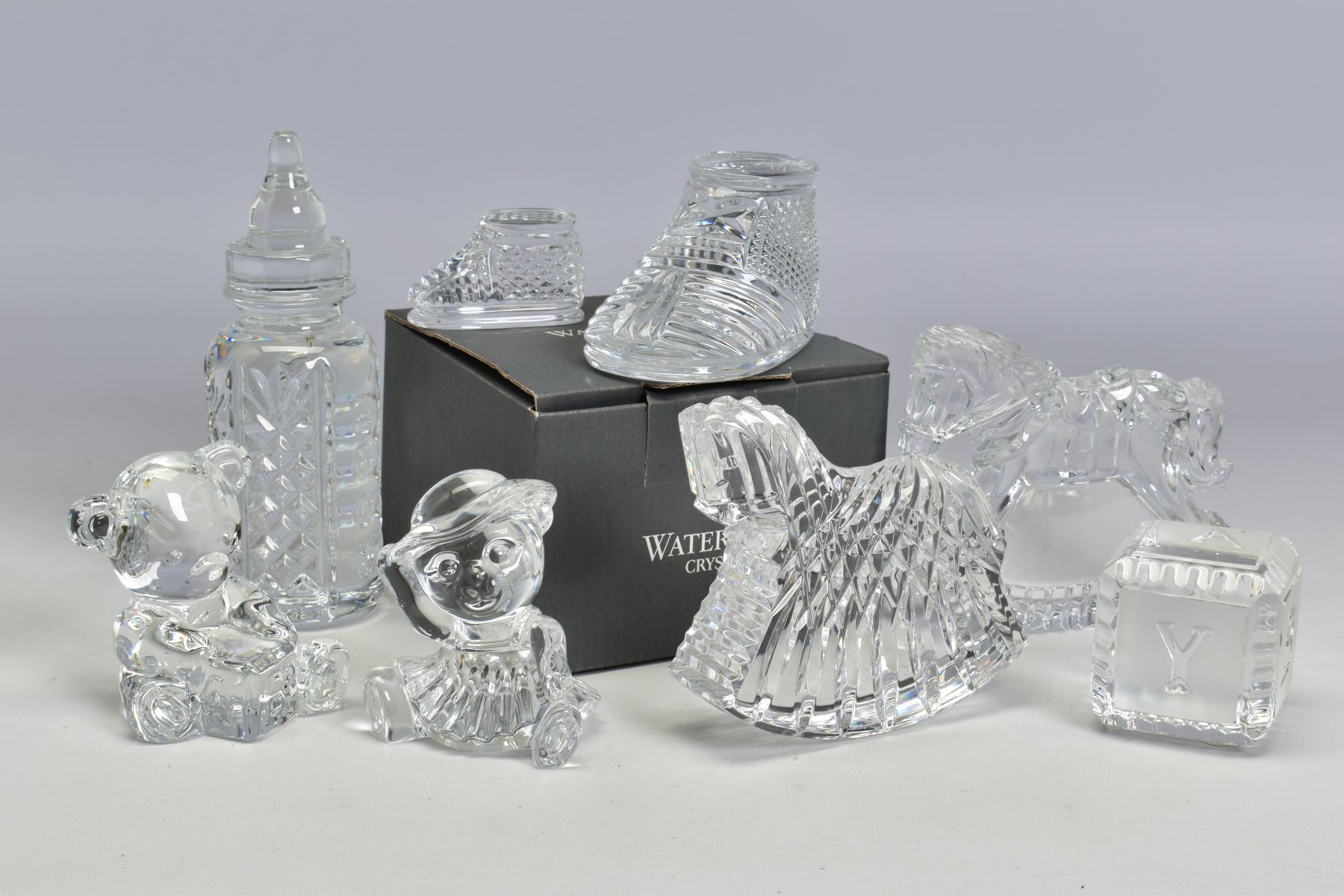 A GROUP OF WATERFORD CRYSTAL NURSERY RELATED ITEMS, comprising a boxed 'Baby Boot' length 10cm, a