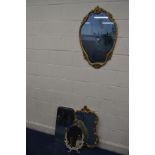 A LATE 20TH CENTURY FOLIATE GILT METAL SHAPED WALL MIRROR, 54cm x 86cm together with a similar