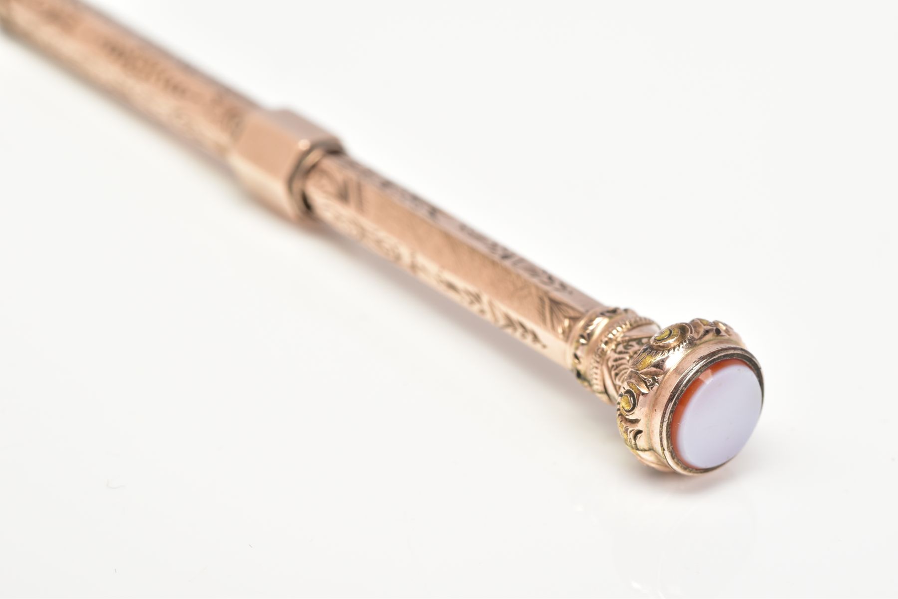 A YELLOW METAL RETRACTABLE PENCIL, designed with a floral engraved pattern to the body of the - Image 2 of 5