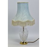 A STUART CRYSTAL LAMP WITH A SHADE, with brass base and fittings, total height including shade 47cm