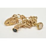 A 9CT GOLD CHARM BRACELET, the charm bracelet which suspends two charms, the first a fob seal