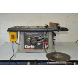 A CLARKE WOODWORKER 10'' TABLE SAW with fence and 2 spare blades 66cm wide x 46cm deep x 29cm high