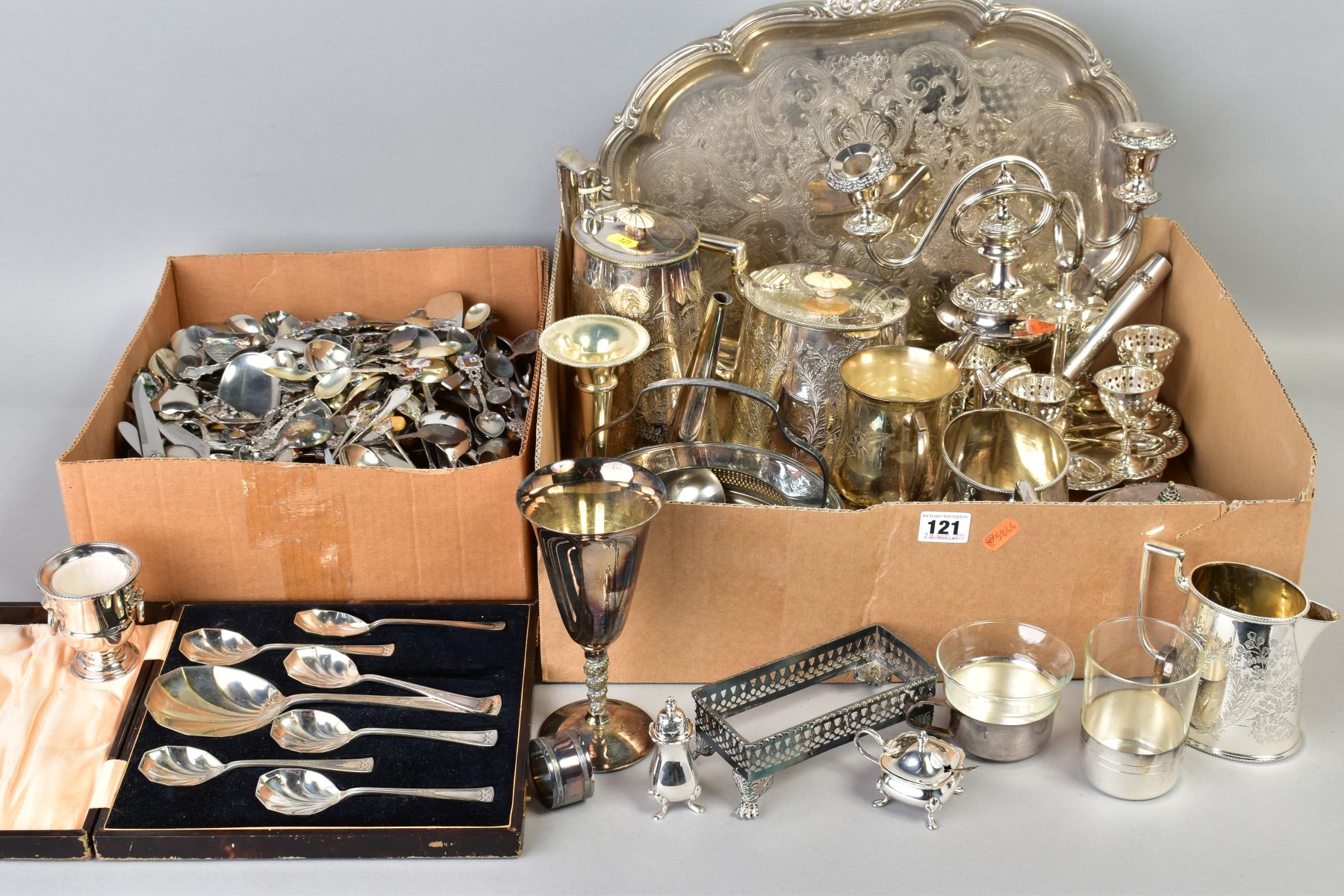 TWO BOXES OF SILVER PLATE, STAINLES STEEL ETC, including souvenir spoons, a small silver handled