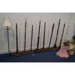 ELEVEN VARIOUS STANDARD LAMPS of various ages, styles and sizes, to include some with barley