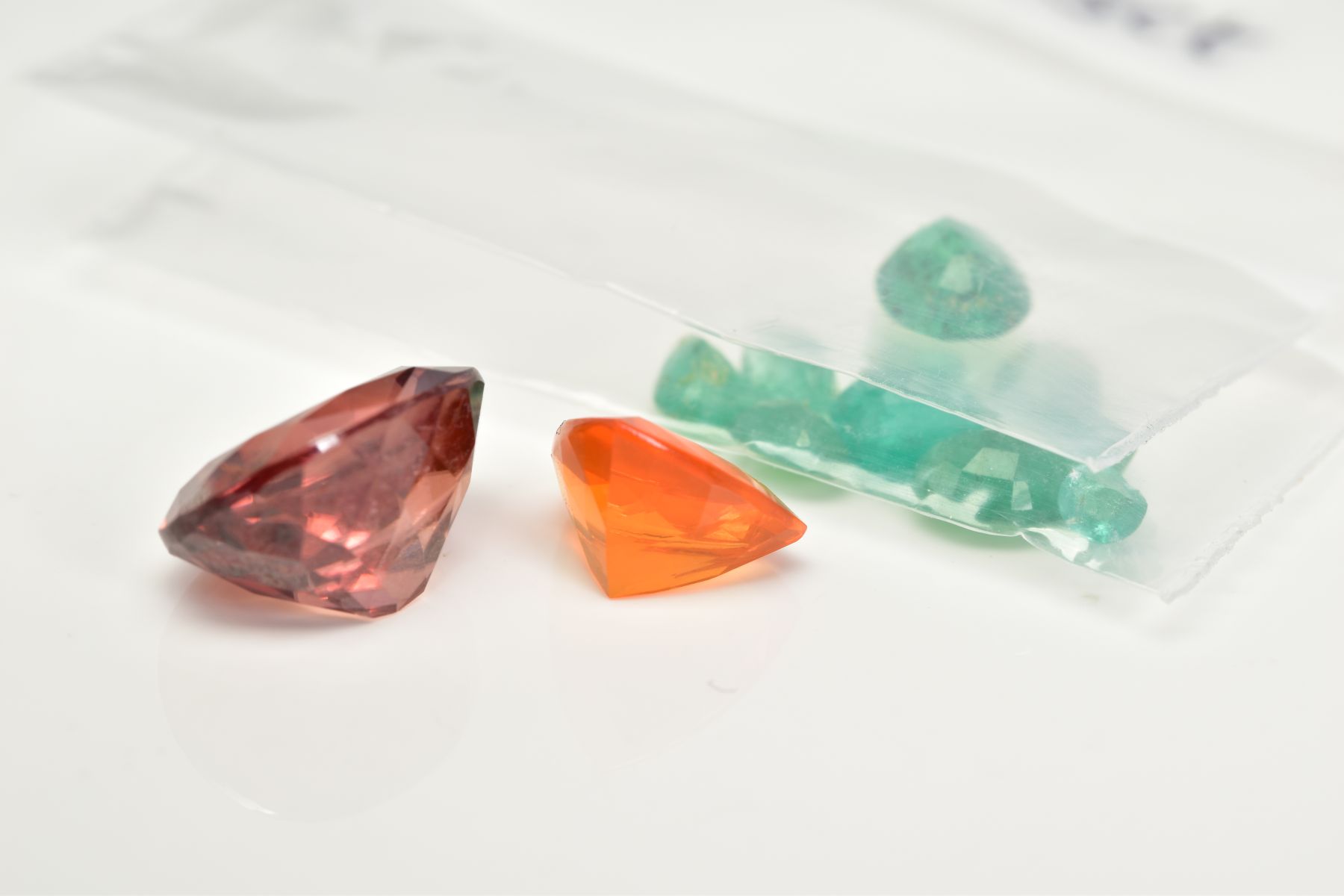 A SELECTION OF LOOSE GEMSTONES, to include a 0.92ct trillion cut fire opal, 7.8 x 7.9 x 4.8mm, a 6. - Image 3 of 3