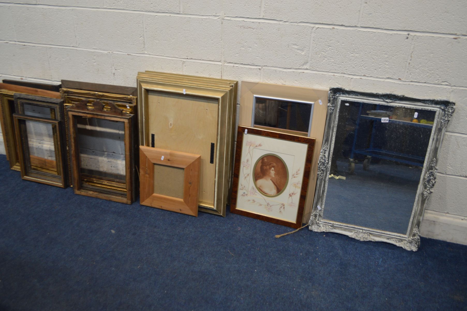 A QUANTITY OF PICTURE FRAMES OF VARIOUS AGES AND SIZES, together with two wall mirror and a modern