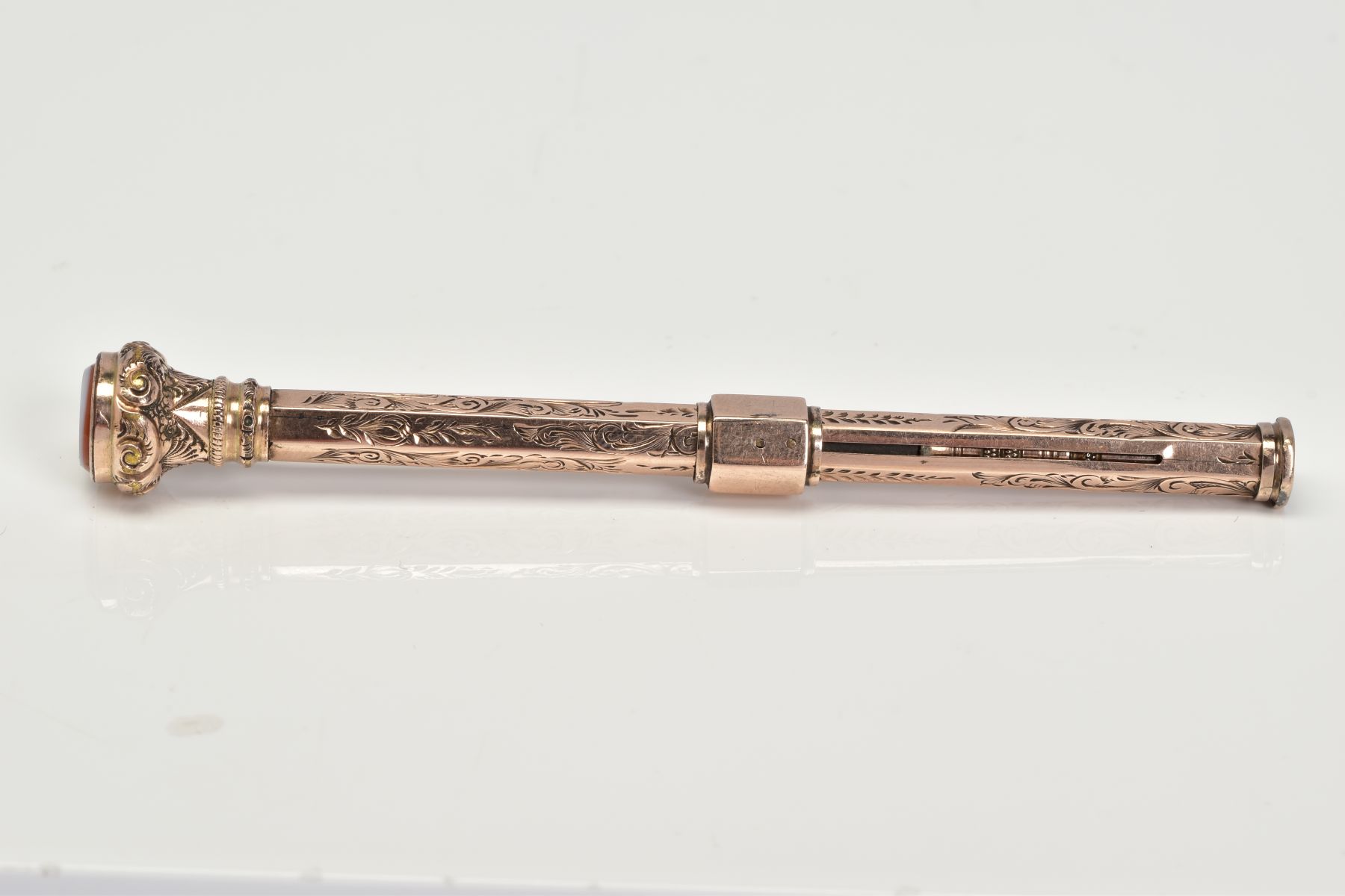 A YELLOW METAL RETRACTABLE PENCIL, designed with a floral engraved pattern to the body of the - Image 4 of 5