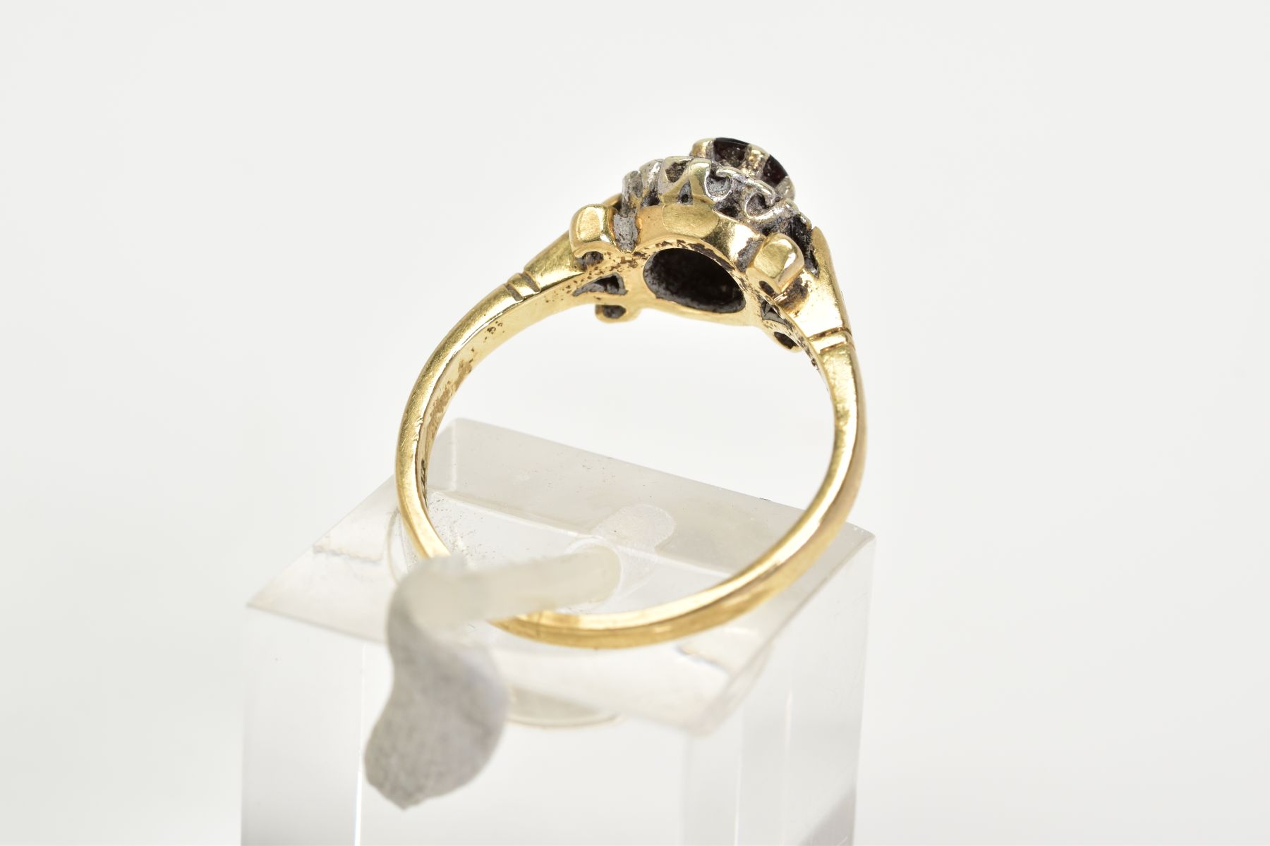A 9CT GOLD GARNET AND DIAMOND CLUSTER RING, set with a central circular cut garnet with a round - Image 3 of 3