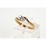 A 9CT GOLD DIAMOND RING, of crossover design set with two claw set round brilliant cut diamonds,