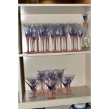 A GROUP OF STUDIO GLASS, WINE GLASSES, ETC, having pink stems and foot, holding blue bowls,