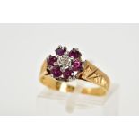 AN 18CT GOLD GARNET AND DIAMOND CLUSTER RING, the tiered cluster set with a central single cut