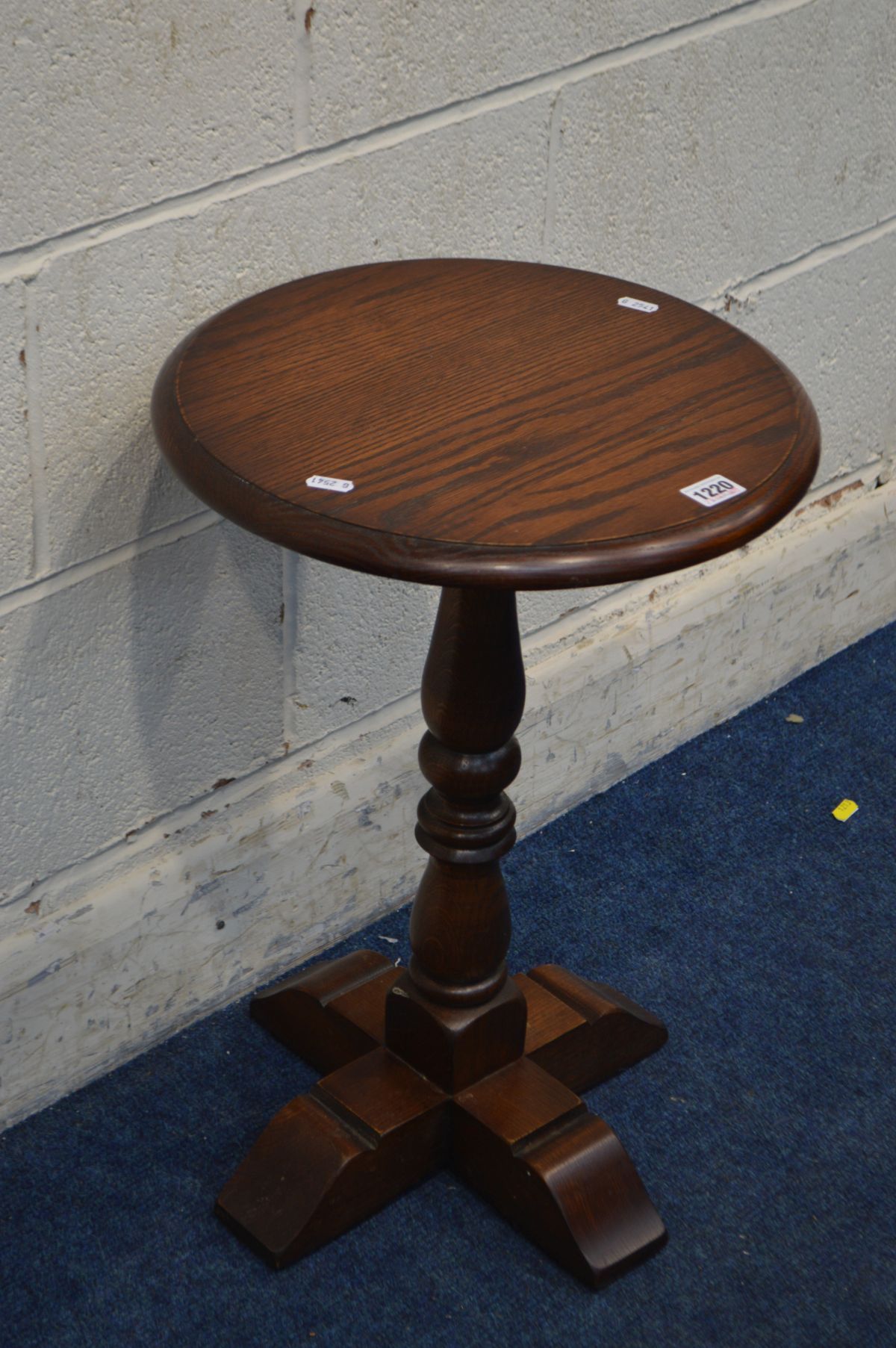 AN OLD CHARM OAK CIRCULAR TOPPED LAMP TABLE, diameter 38cm x height 57cm