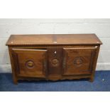 A LOW EARLY 20TH CENTURY OAK AND STRUNG INLAID FRENCH TWO DOOR CABINET, width 124cm x depth 31cm x