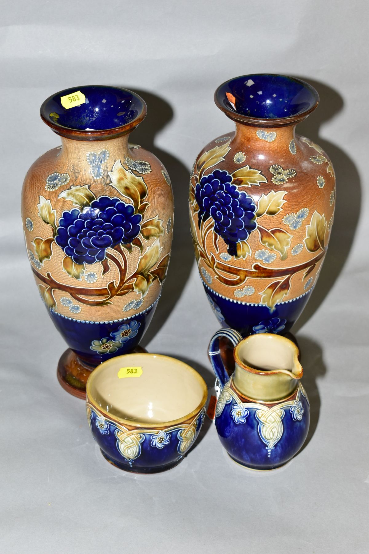 A PAIR OF ROYAL DOULTON, DOULTON AND SLATTERS PATENT BALUSTER VASES, the buff textured ground tube