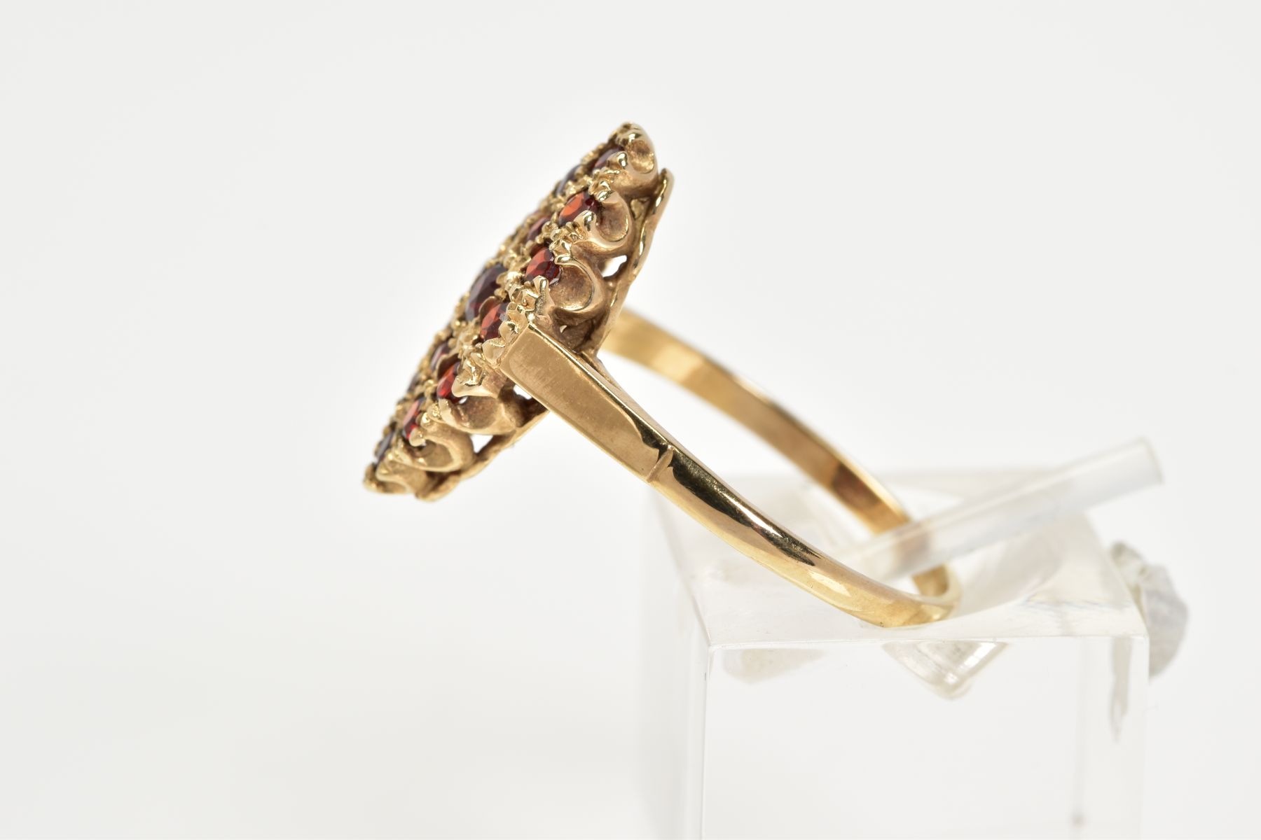 A 9CT GOLD GARNET RING, of lozenge set with fifteen circular cut garnets, to the plain polished - Image 2 of 3