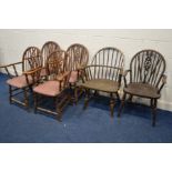 A SET OF FOUR OAK WHEELBACK OPEN ARMCHAIRS, together with another wheelback armchair and an oak hoop