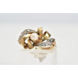 A 9CT GOLD PEARL AND DIAMOND RING, the two-tone openwork ring set with a single cultured pearl and
