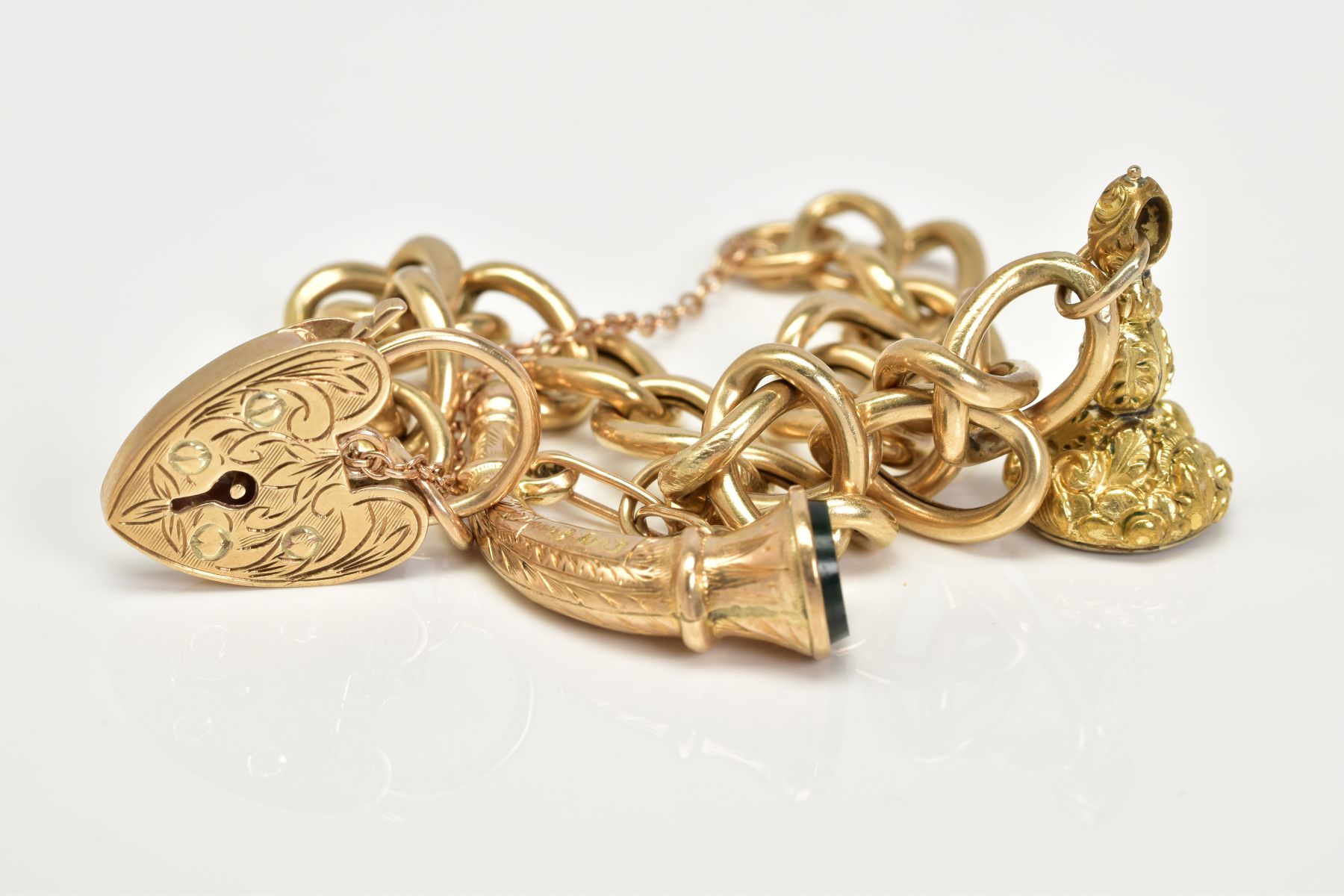 A 9CT GOLD CHARM BRACELET, the charm bracelet which suspends two charms, the first a fob seal - Image 4 of 4