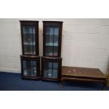 TWO MODERN MAHOGANY GLAZED SINGLE DOOR CORNER CUPBOARDS together with a modern mahogany coffee table