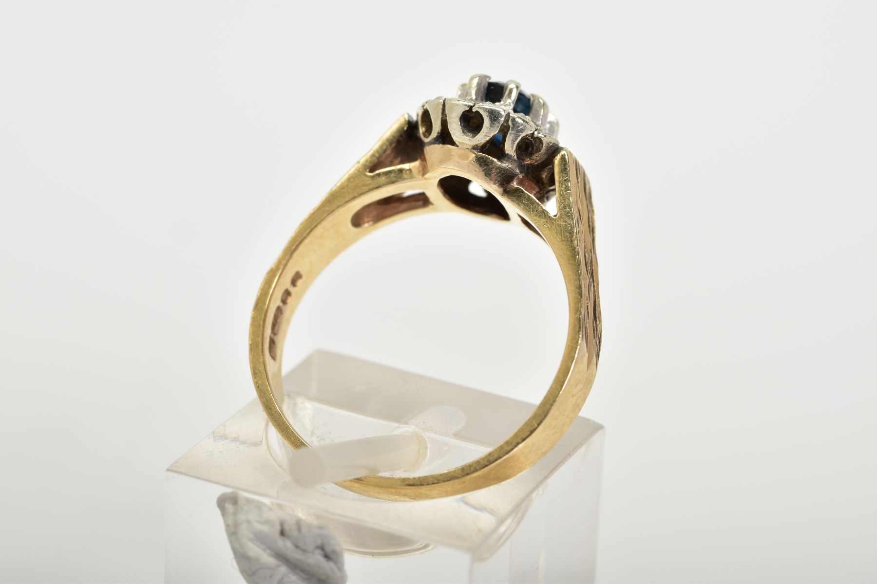 A 9CT GOLD SAPPHIRE AND DIAMOND RING, of a tiered cluster design with a central claw set oval cut - Image 3 of 3