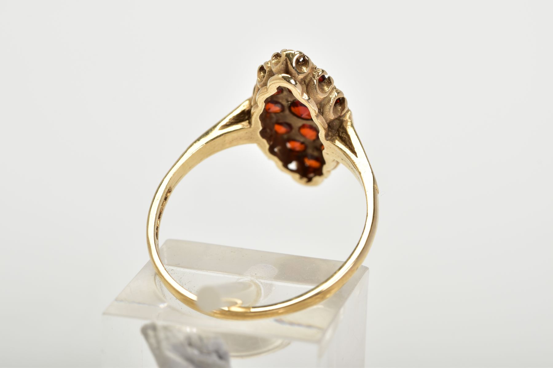 A 9CT GOLD GARNET RING, of lozenge set with fifteen circular cut garnets, to the plain polished - Image 3 of 3