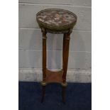 A LATE 20TH CENTURY CIRCULAR MARBLE TOPPED AND WALNUT TORCHERE STAND, with a brass gallery and