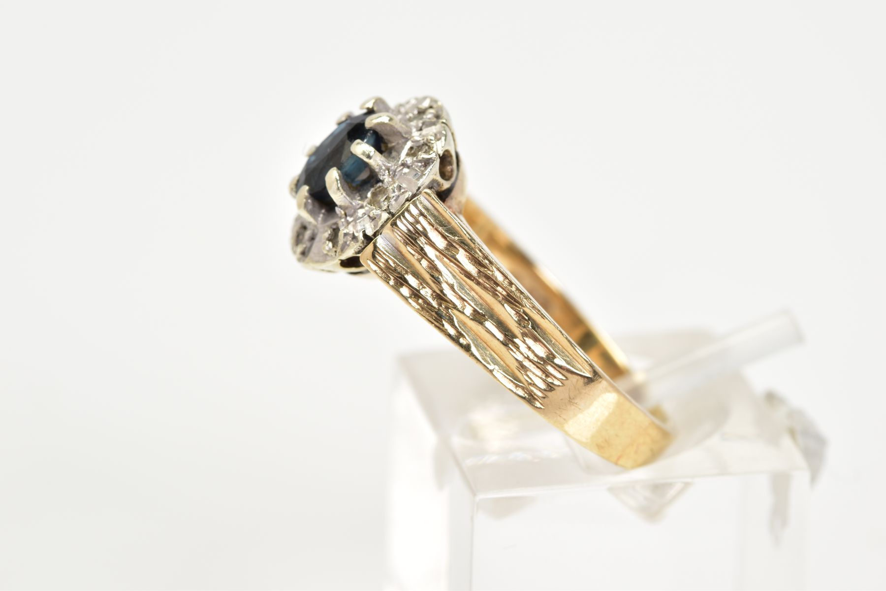 A 9CT GOLD SAPPHIRE AND DIAMOND RING, of a tiered cluster design with a central claw set oval cut - Image 2 of 3