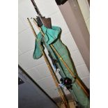 TWO SNOOKER CUES AND A BAG OF FISHING RODS etc, including net, umbrella, five unbranded split