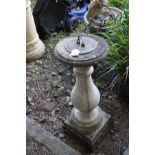A THREE PIECE COMPOSITE SUNDIAL with a brass dial, balustered column and a square base, height 88cm
